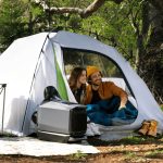 Two people inside a tent with EcoFlow WAVE 3 Air Conditioner