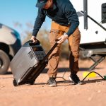 DELTA Pro 3 Being Pulled By The Handle By A Man Next To A RV